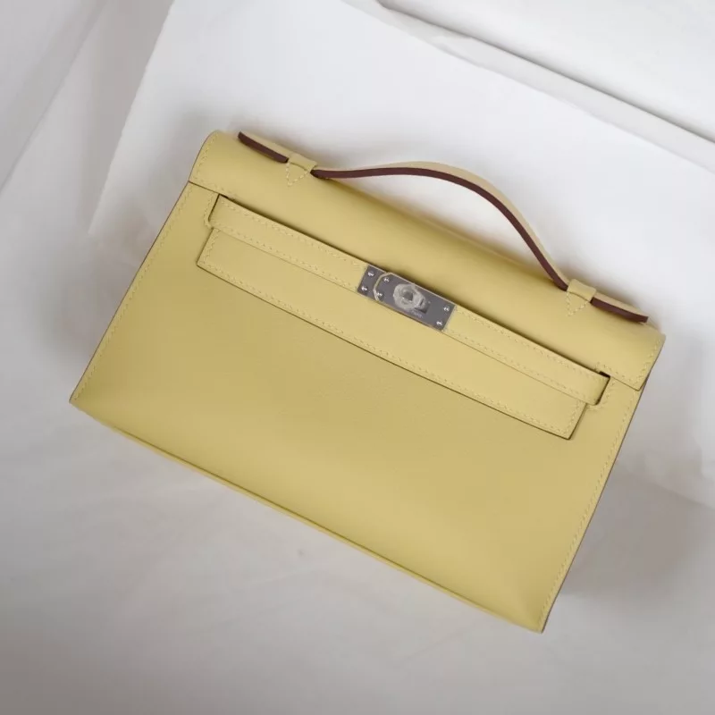 1z jaune pussin swift kelly pochette with phw