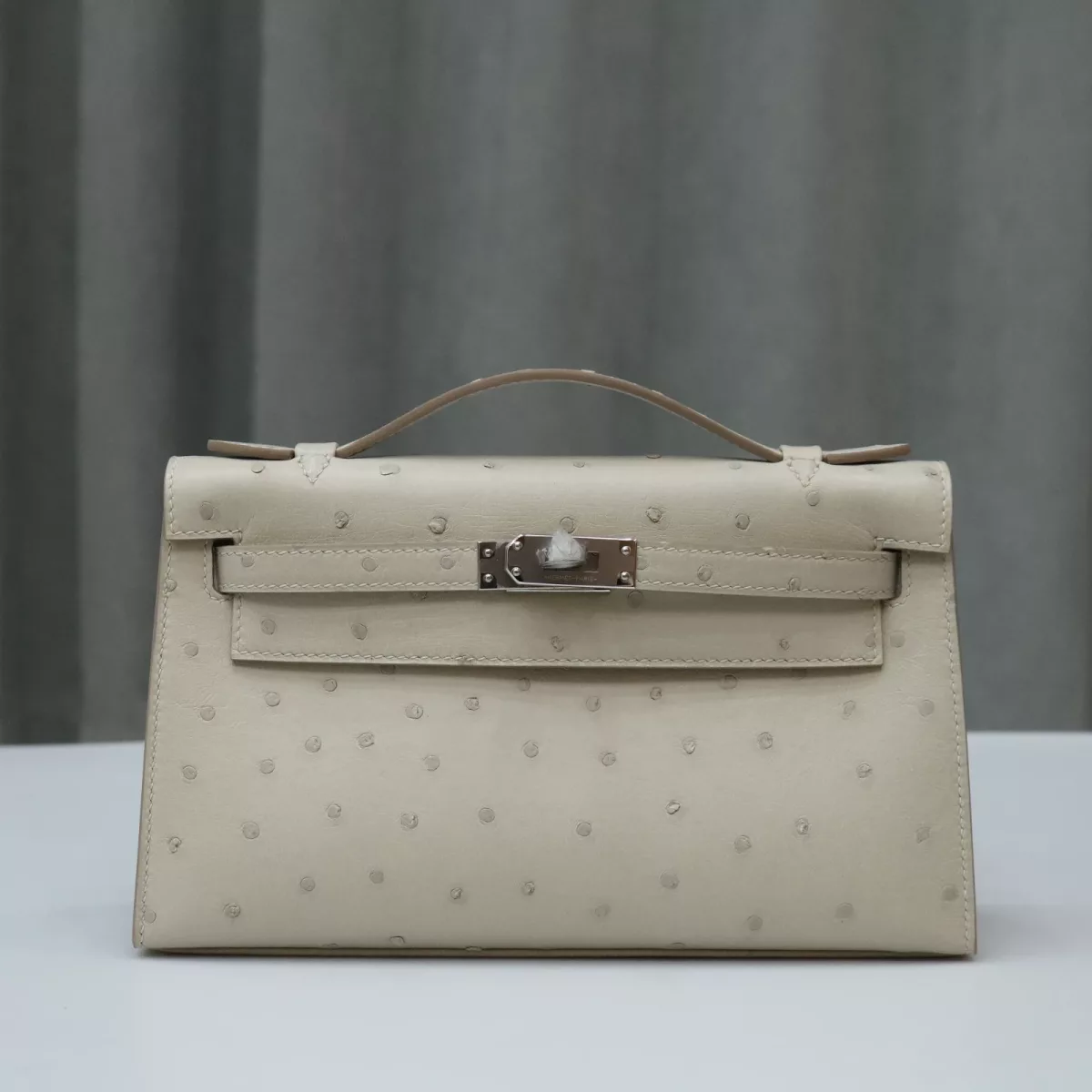 8L beton Ostrich kelly Pochette with PHW