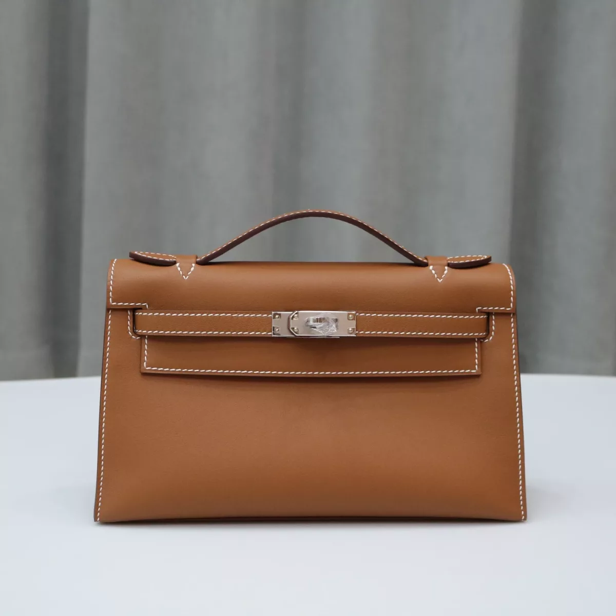 C37 GOLD Swift kelly pochette with phw