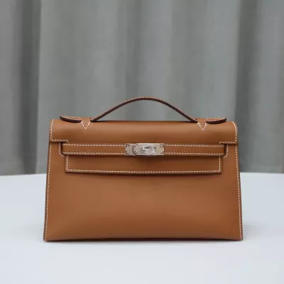 C37 GOLD Swift kelly pochette with phw