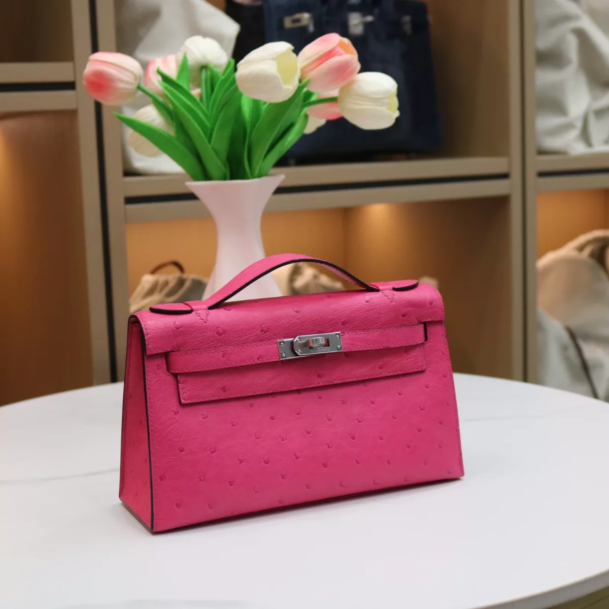 E5 Rose Tyrien ostrich kelly pochette with phw