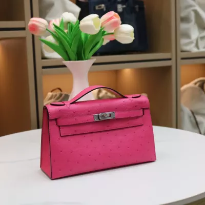 E5 Rose Tyrien ostrich kelly pochette with phw